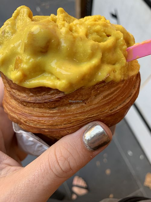 mango turmeric ice cream in a croissant cone   at Weirdoughs in Melbourne