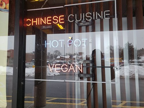 Neon VEGAN sign in the window! at Super Bowl Cuisine in Kingston
