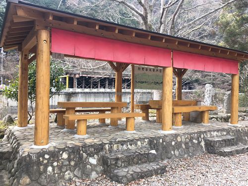 Beautiful outdoor seating by the river at Takijirichaya in Tanabe