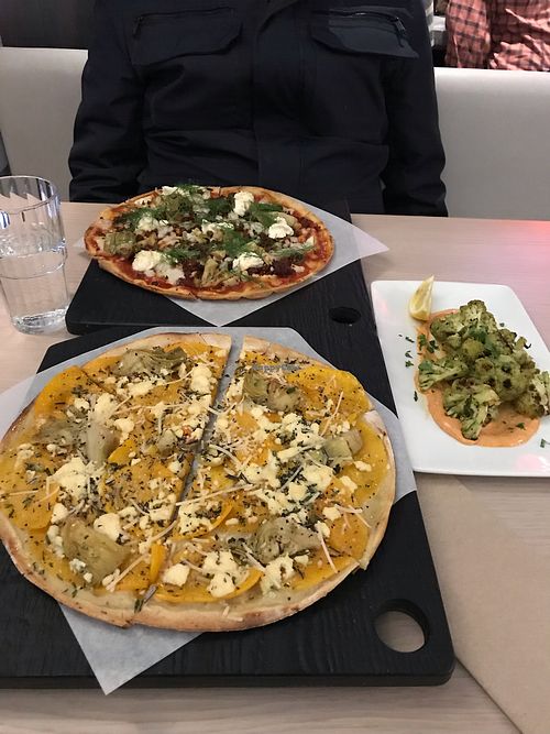 The harvest without mushrooms and artichoke instead.the chorizo pizza . Harissa at Virtuous Pie in Toronto