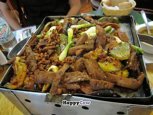 huge faux-meat dish served on a heated grill with tortillas and salsa - definitely for sharing at Yug in Mexico City