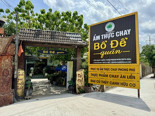 View of sign and entrance from main road  at Bo De Quan in My Tho