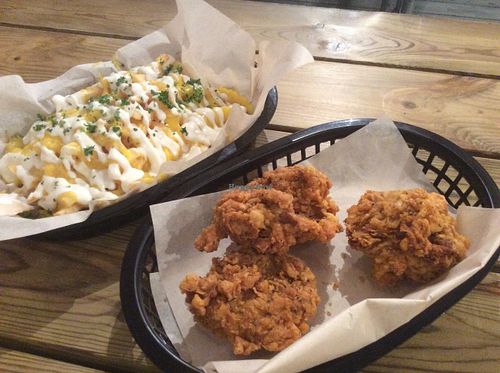 Chips with cheese and garlic sauce and deep fried chicken at Junk It Up in Newcastle Upon Tyne