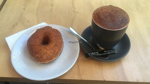 Vegan cinnamon donut and medium almond cappuccino 🌱 at Milk Belly in Fremantle