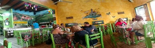 'Panorama' of interior taken with phone. Not shown: salad bar. Distortion due to first time use of panorama function! Included to show informality of the place. Food worthy of more formal dining, in my not-so humble opinion.  at Planeta Vegetariano in Puerto Vallarta