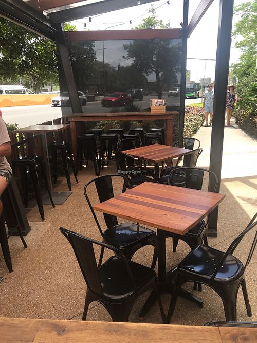 Small patio area. It is right along the highway, but I hardly even noticed it.  at BKA Vegan in Burleigh Heads