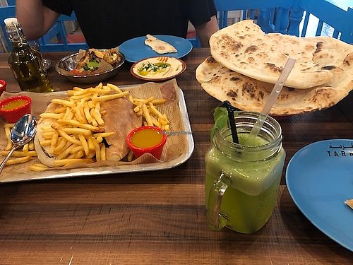 2 falafel/mixed veg sandwiches with really good fries. We all loved the roasted veg plate with cauliflower and eggplant and the fresh bread and hummus were fantastic. at Tarma in Kuala Lumpur