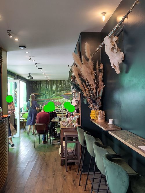Seating inside with cow skull on the wall at Gartensalon in Munich