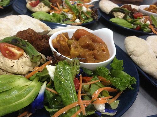 Food made on request; variety with hummus , falafel, pita with potato curry and feta olive salads at Ganita Cafe in Pai