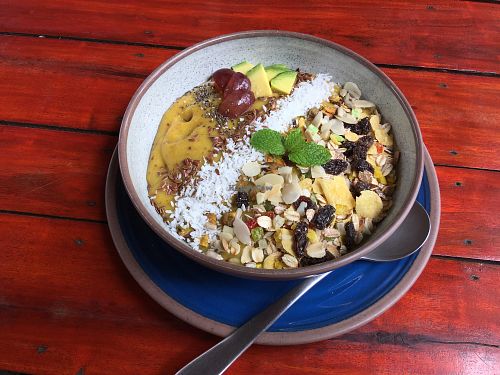 Breakfast Bowl with granola, nuts and seeds based on coconut banana smoothie at Ganita Cafe in Pai