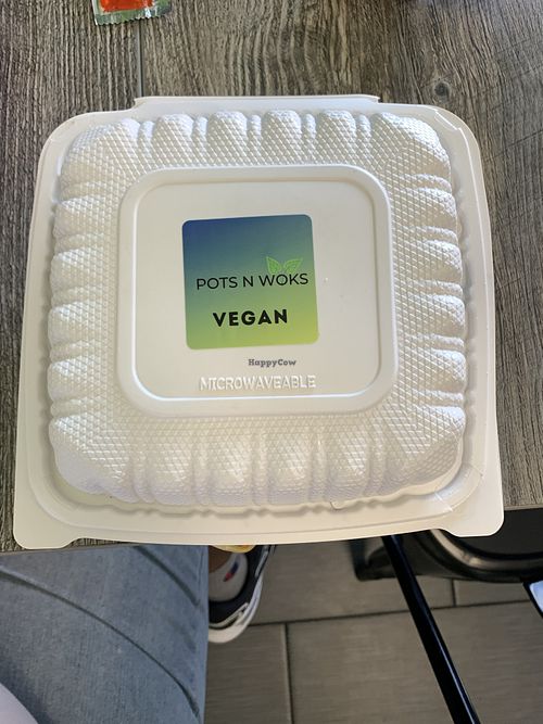 Clearly labeled vegan to go box  at Pots N Woks in Whittier