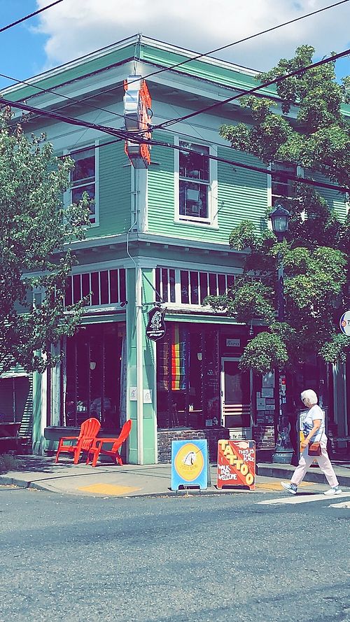 Entrance and outdoor seating in summer at Just Bob in Portland