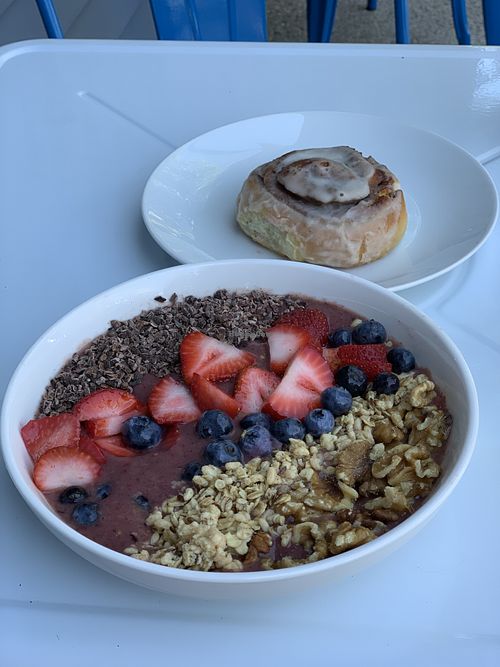 Cinnamon bun and açaí bowl  at Root in Newport