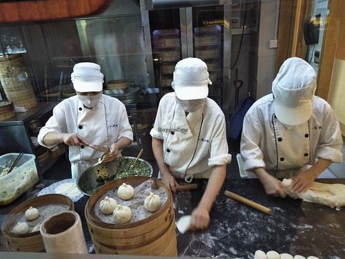 Staff making baozi, fascinating and they are delicious. at Táiwān RénDào SùCài in Shanghai