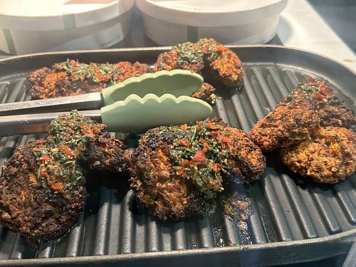 Chick pea and carrot patties with chimichuri   at The Naked Deli - Grey St in Newcastle Upon Tyne