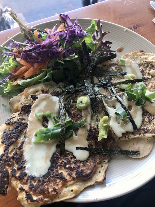 okonomiyaki (Japanese pancake) - served burnt , bottom is even more burnt than the tops at Plant Based Wholefoods in Katoomba
