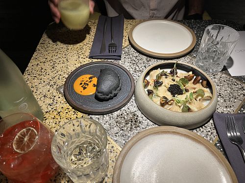 Empanada, raviolis, vegetable cobbler mocktail, hibiscus kombucha cocktail  at SACRO in Buenos Aires