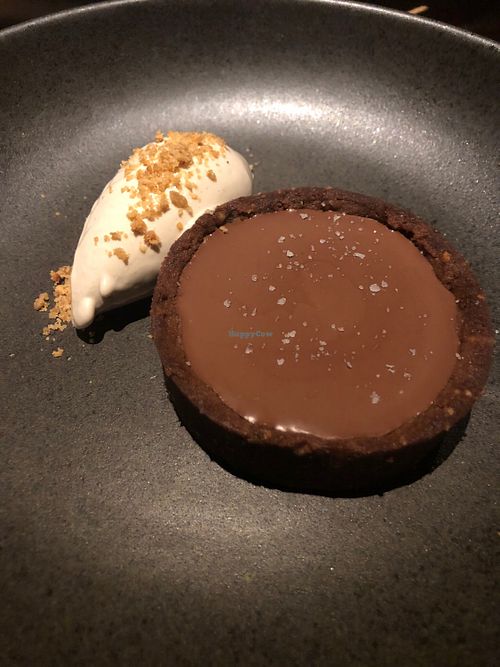 Chocolate and salted caramel tart with peanut butter ice cream.  at SACRO in Buenos Aires