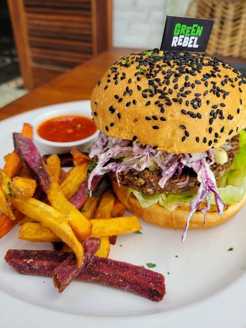 Green rebel burger with sweet potato fries at Manggis in Canggu in Canggu