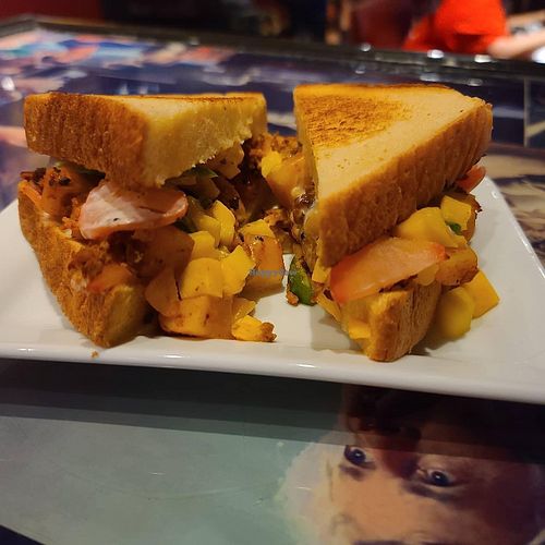 “The Dirty South" is a vegan chorizo and potato hash with mango salsa, pickled radish, and vegan lemon garlic crema on Texas Toast. at Queen City Cinema Club in Bangor