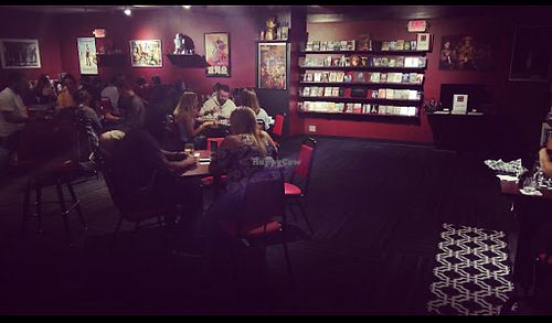 Area for board games, food and drink, and socializing. at Queen City Cinema Club in Bangor