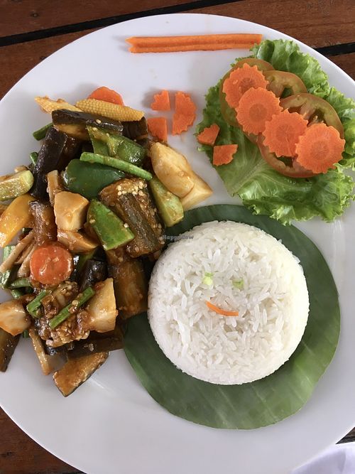 Stir fried eggplant with rice (the owner’s daughter added a smiley face to the rice)  at Bar Ang in Battambang