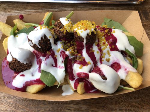 French fries with pink hummus and falafel  at Frittenwerk - Ehrenstraße in Cologne