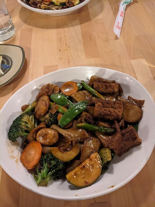 Vegetable stir fry with chow fun noodles, tofu, and hunan sauce. at GingeRootz Asian Grille in Appleton