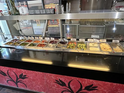 Selection of toppings   at Amsterdam Falafelshop in Miami