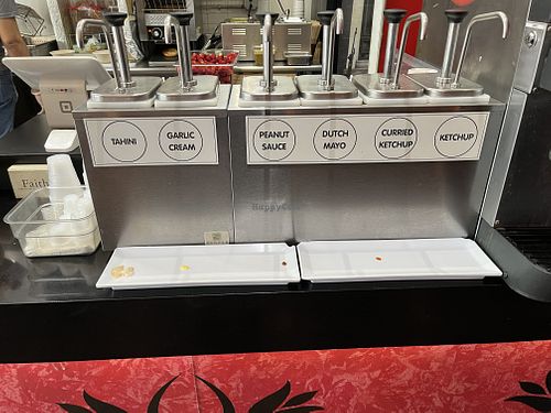 Sauces, tahini, peanut sauce., curry ketchup and ketchup are all vegan  at Amsterdam Falafelshop in Miami