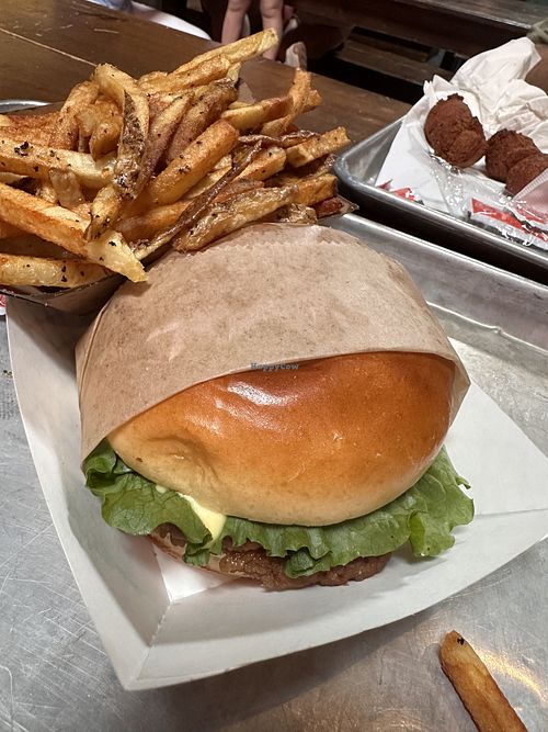 “You’re a Vegan” burger with a side of fries  at CowBar in Raleigh