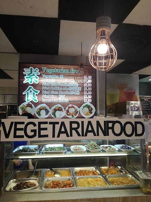 Stall front and menu in the background
photo credit to Daniel Chai at Vegetarian Food in Central Singapore