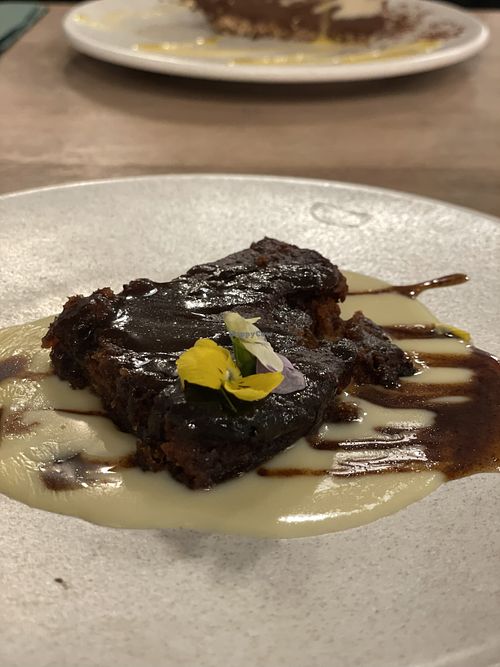 Sticky toffee pudding with custard  at Stem & Glory in London