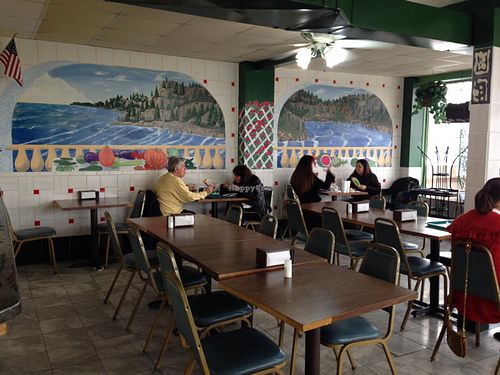 clever paintings on the seating area wall at Big Al's Healthy Foods in Tulsa