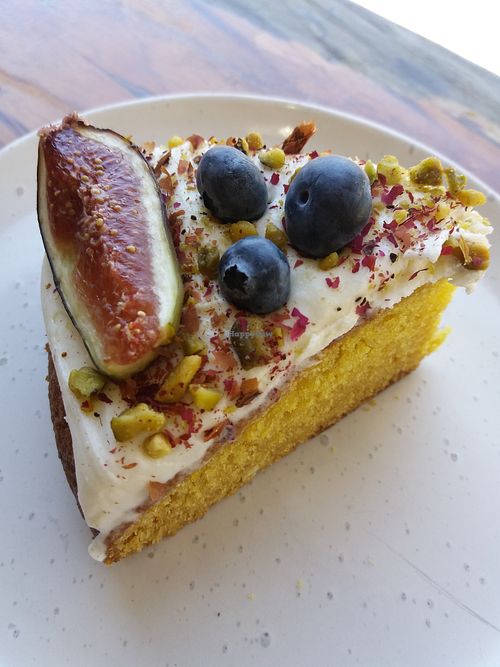 Orange cake with rose tahini, figs and blueberries garnish at Khamsa in Erskineville