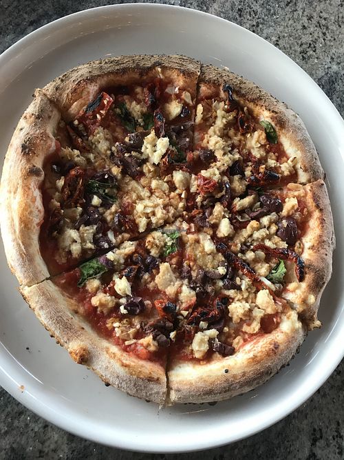 Vegan margarita pizza add kalamata olives, garlic and sun-dried tomatoes  at Firecrust in Sherwood Park
