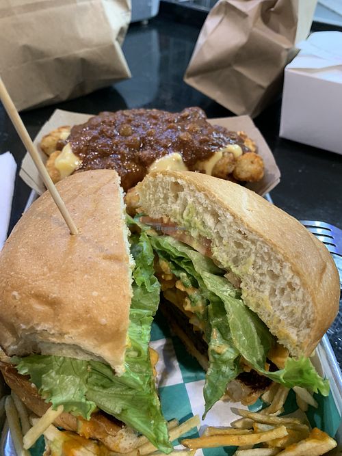 Balvin Burger with loaded tater tots  at Vegan Junkie - Tavern Flower Food Truck in Fort Lauderdale
