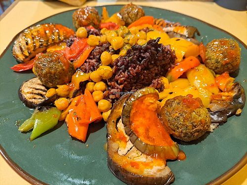 Mixed vegan dish with purple rice, chickpeas, falafel, and roast veggies. at Soup in Town in Lucca