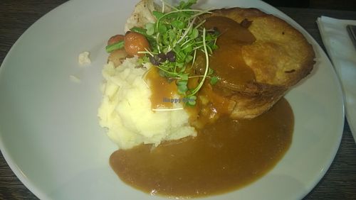 Layered vegetable shortcrust pastry pie, mashed potatoes and onion gravy at Evan's Bistro in Whitley Bay