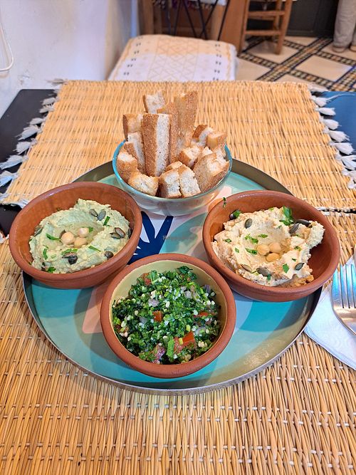 Hummus and tabouleh with bread sticks at Veggie Pause  in Fes
