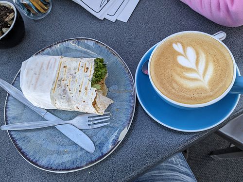 Vegan falafel wrap and almond milk flat white. at Astro Cafe in Lake Tekapo