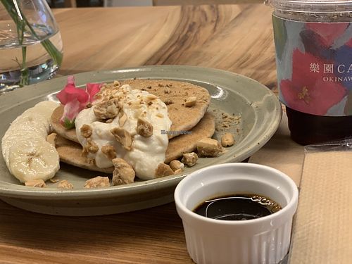 Pancakes with brown sugar syrup and nuts. You can order without whipped cream. I’m not sure what is the whipped cream made from. It was my non vegan friend order.  at Rakuen Cafe in Naha