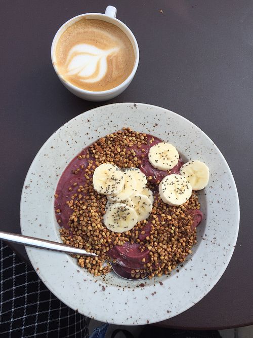 Vegan acai and raspberry smoothie bowl with chia pudding and buckwheat at Pom & Flora in Stockholm