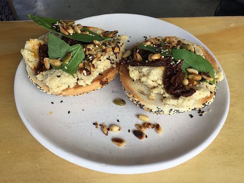 Vegan bagel with hommus, pine nuts and sundried tomatoes  at Bad Love Club in Footscray