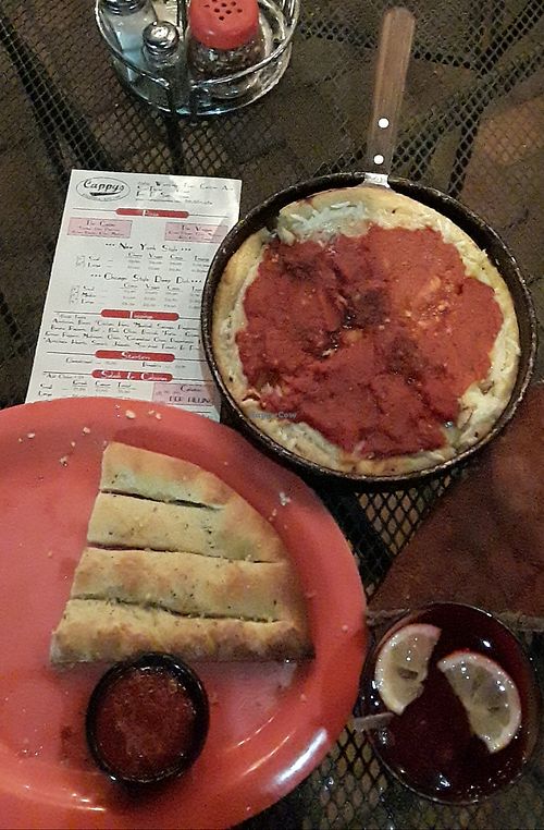 Vegan Chicago stlye deep dish Pizza and garlic breadstix. at Cappy's Pizzeria in Riverview