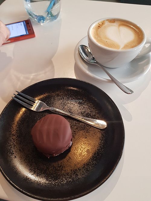 Bounty candy and cappuccino ❤️ at BioBio in Riga