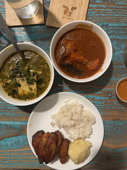 Okra stew with tofu, tomato stew with mushrooms, plantains, rice, corn fufu  at Akadi in Portland