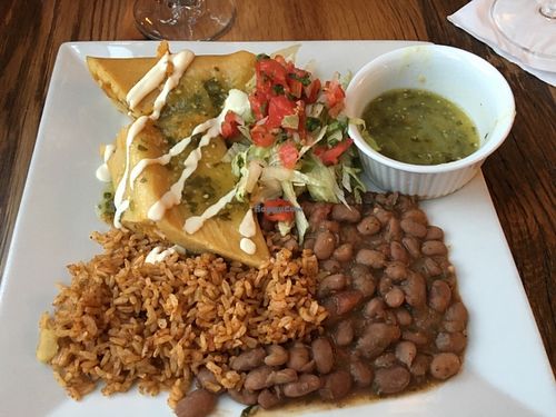 Tamales made in the corn husk with aceite rice and pinto beans.  Dinner entree. at Ravens' Restaurant in Mendocino