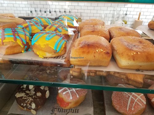 Pictured on bottom both the chocolate and garden donuts are vegan. The donuts onto are not vegan at Kudough's Donuts in San Juan