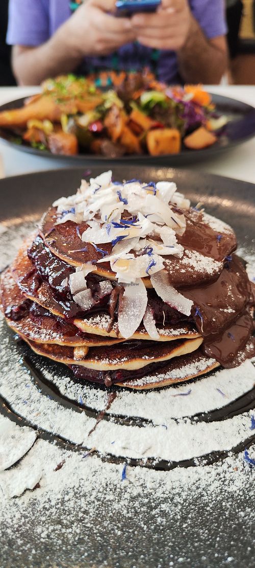 Pancakes with belgian ciocolate, coconut flakes and raspberry jan at Flow Specialty Coffee Bar & Bistro in Budapest